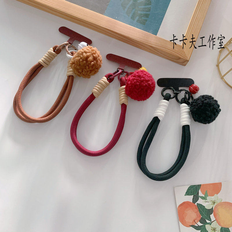 时尚秋冬铃铛毛球吊坠安可拉红手机短挂绳防摔手腕绳ccd相机挂链