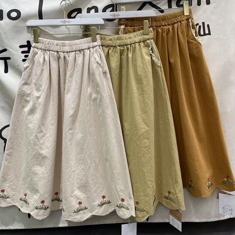 文艺森系甜美高腰秋季新款刺绣半身裙女宽松减龄气质波浪边中长裙