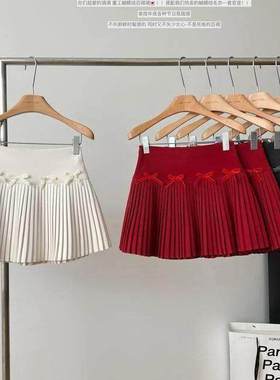 白色蝴蝶结毛呢半身裙女春季新款辣妹A字百褶裙高腰显瘦百搭短裙