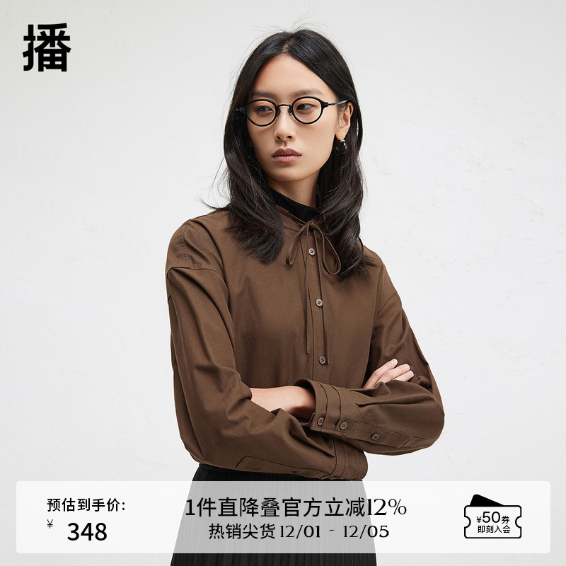 时髦串绳立领，袖口三层压褶设计