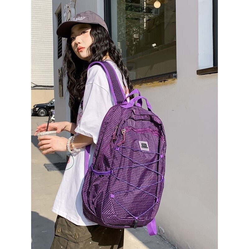 日本彩色个性格子工装风抽绳尼龙背包新款轻便户外登山徒步双肩包
