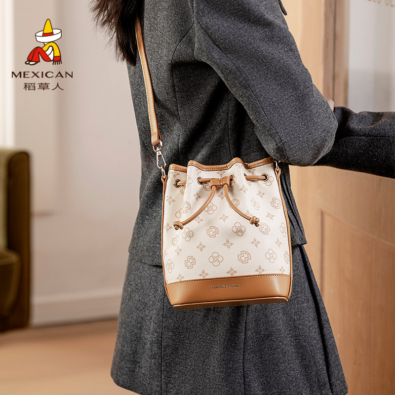 稻草人包包女2025新款老花包轻奢抽绳双肩包手提水桶包单肩斜挎包,箱包皮具/热销女包/男包,水桶包,淘宝优惠券,粉丝福利购,淘宝优惠卷