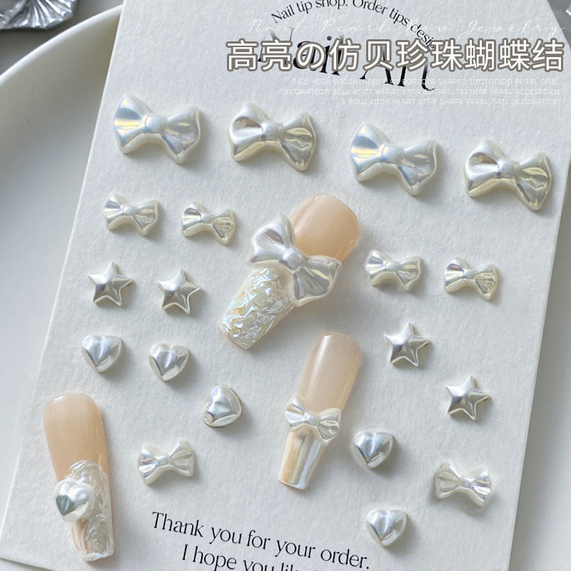 新款高亮仿贝珍珠爱心蝴蝶结美甲饰品质感立体幻彩平底指甲钻配饰