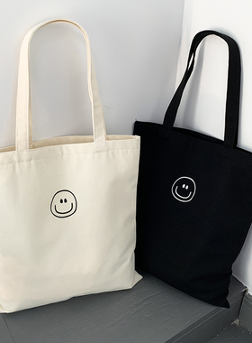 可爱笑脸简约日系百搭帆布包包男女大学生上课装书手提单肩环保袋