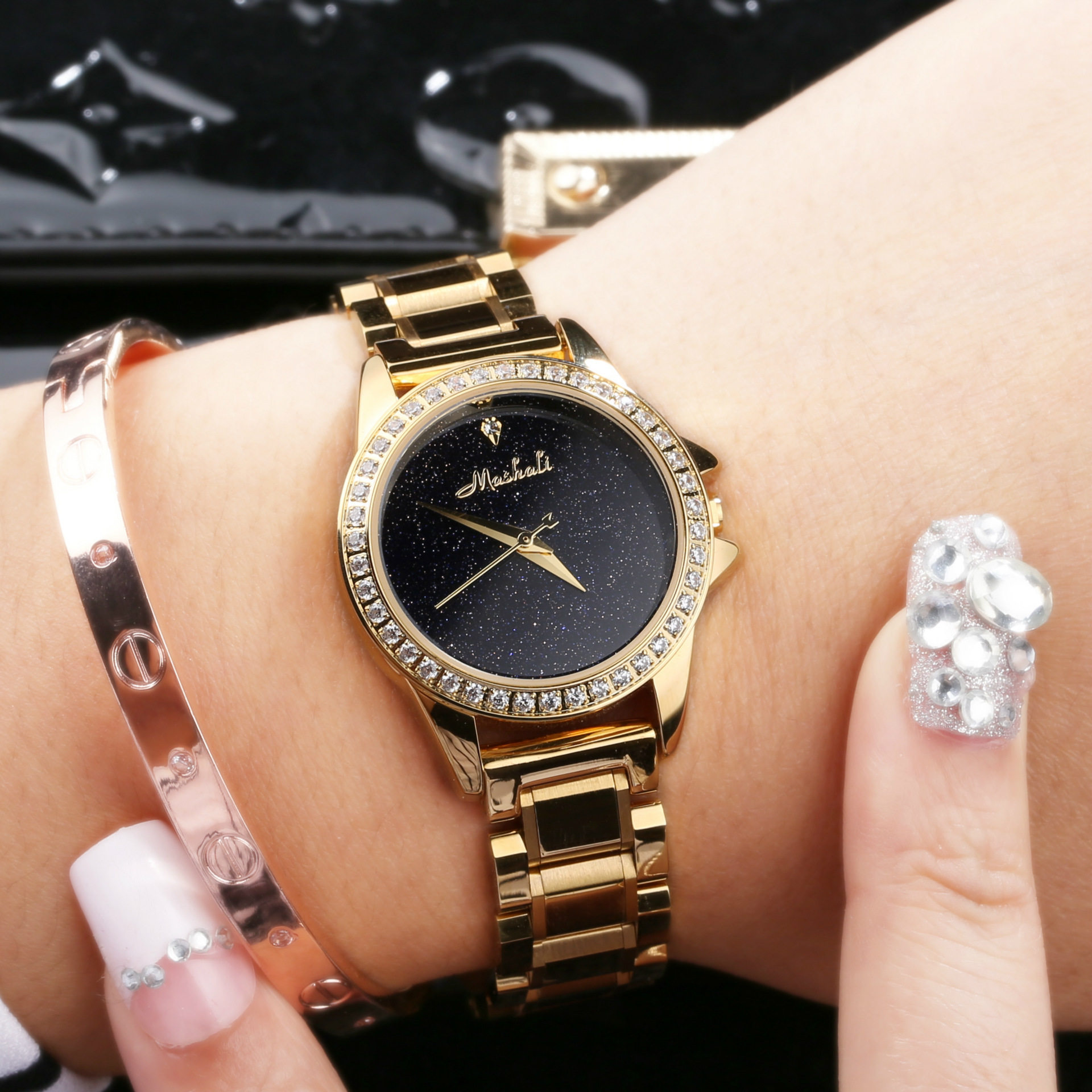 玛莎莉新款时尚潮流指针式钢带蝴蝶扣女表防水星空石英表