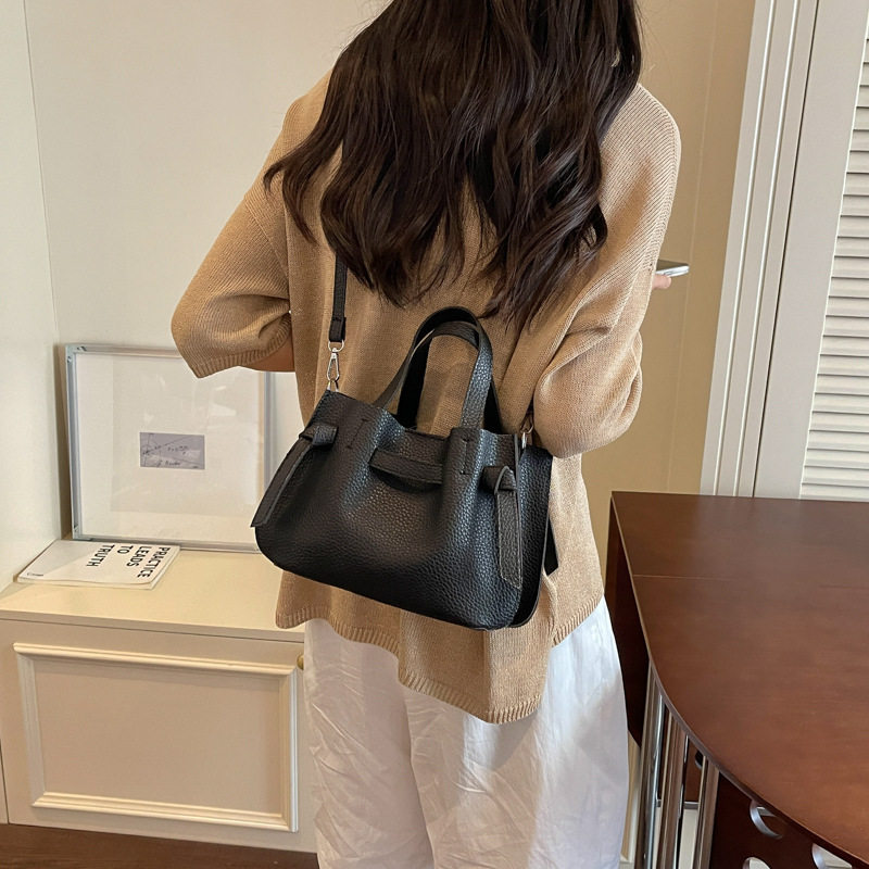 韩版简约荔枝纹子母包女2026新款潮时尚通勤斜挎包百搭抽绳水桶包