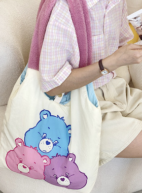 carebears小熊秋季新款大容量双面背充棉单肩帆布包学生上课书包