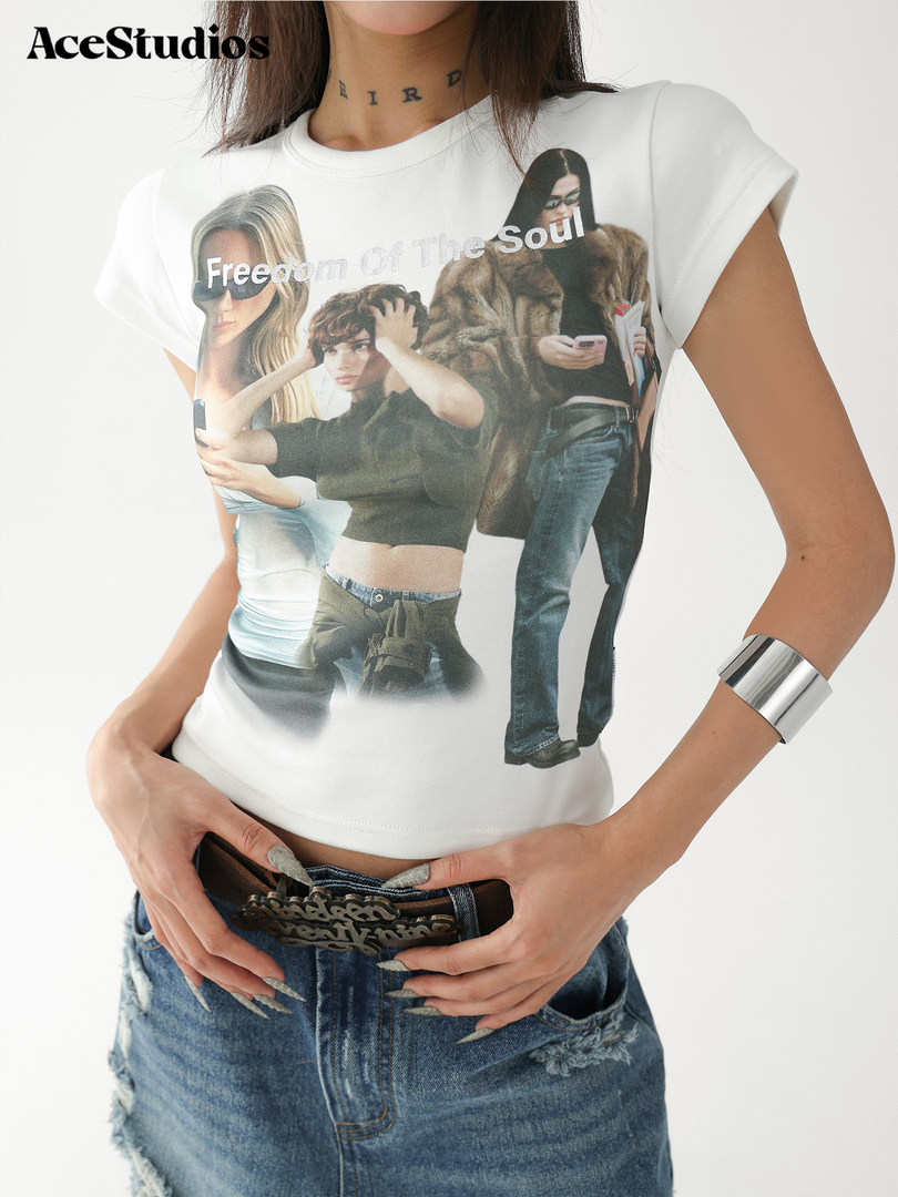 Model wearing a white graphic short-sleeve T-shirt with printed collage artwork and text