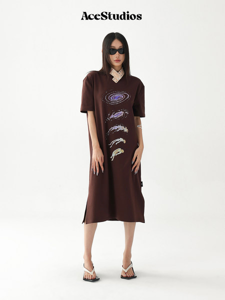 Model wearing a brown graphic oversized dress with short sleeves