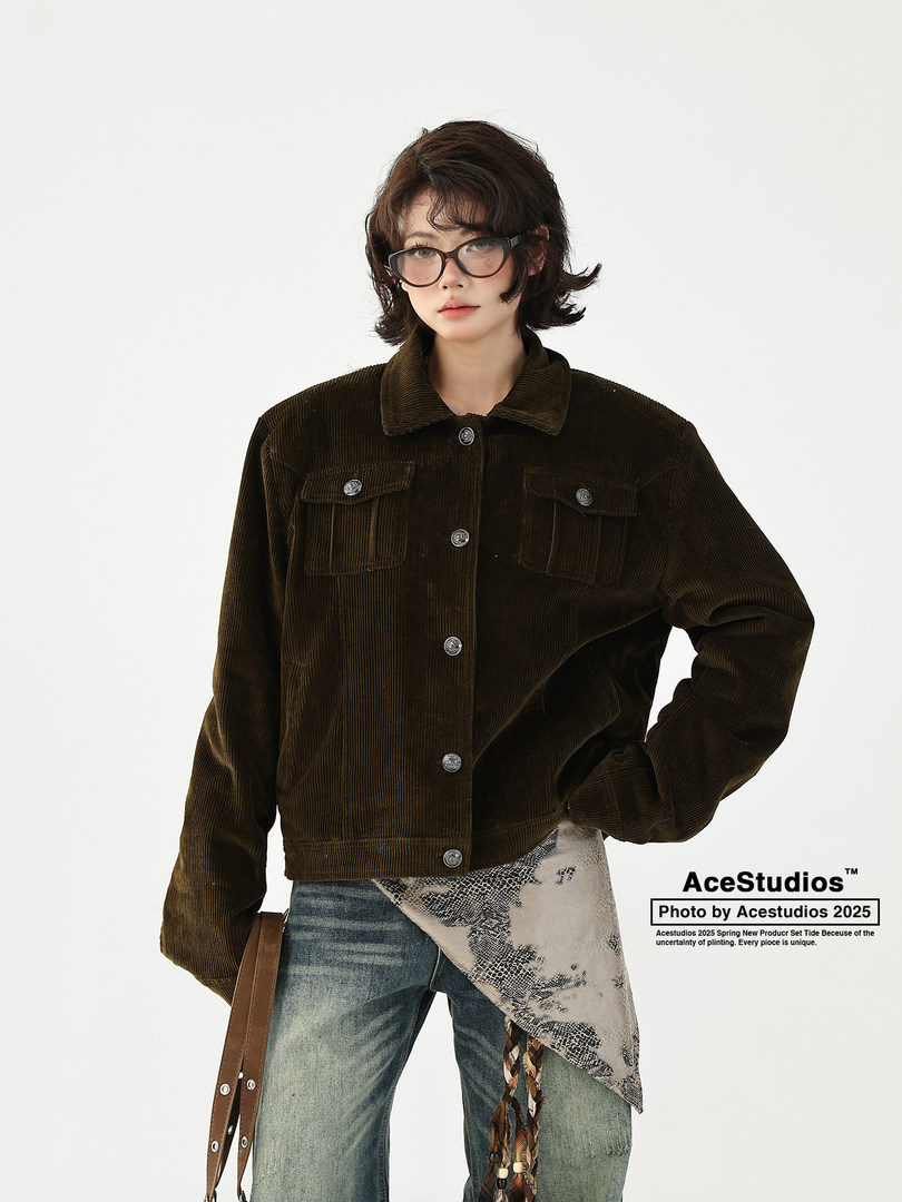 Model wearing a dark brown corduroy button-up jacket with jeans