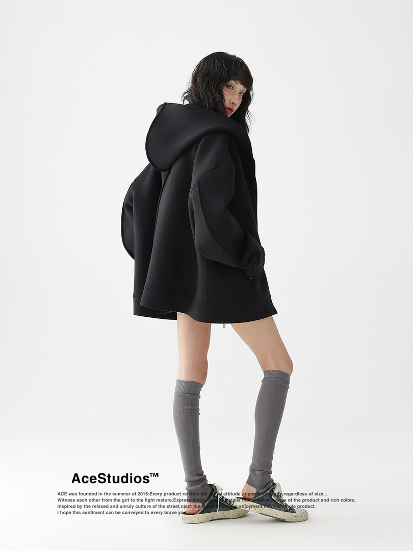 Black oversized hooded jacket worn by a model
