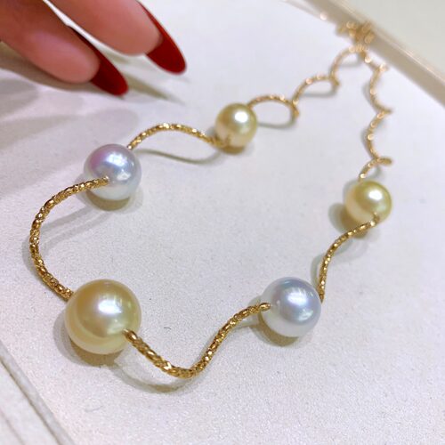 白珠10-11mm  金珠11-12mm 近正圆微瑕 自然弯曲，附证书