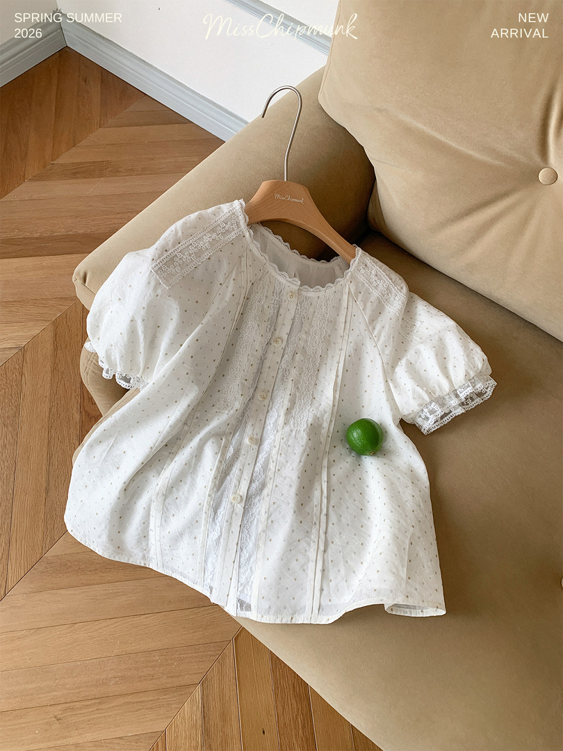 White lace puff-sleeve blouse laid on a sofa with spring summer new arrival text overlay