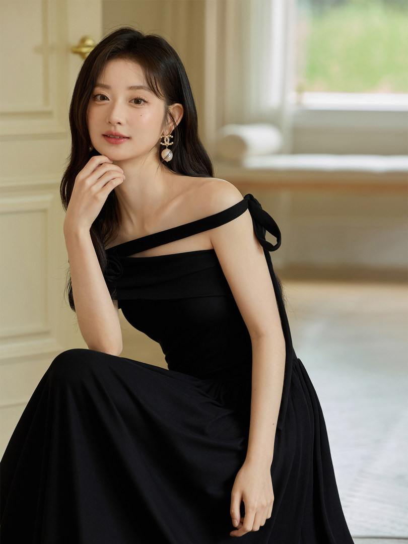 Black off-shoulder dress worn by a model