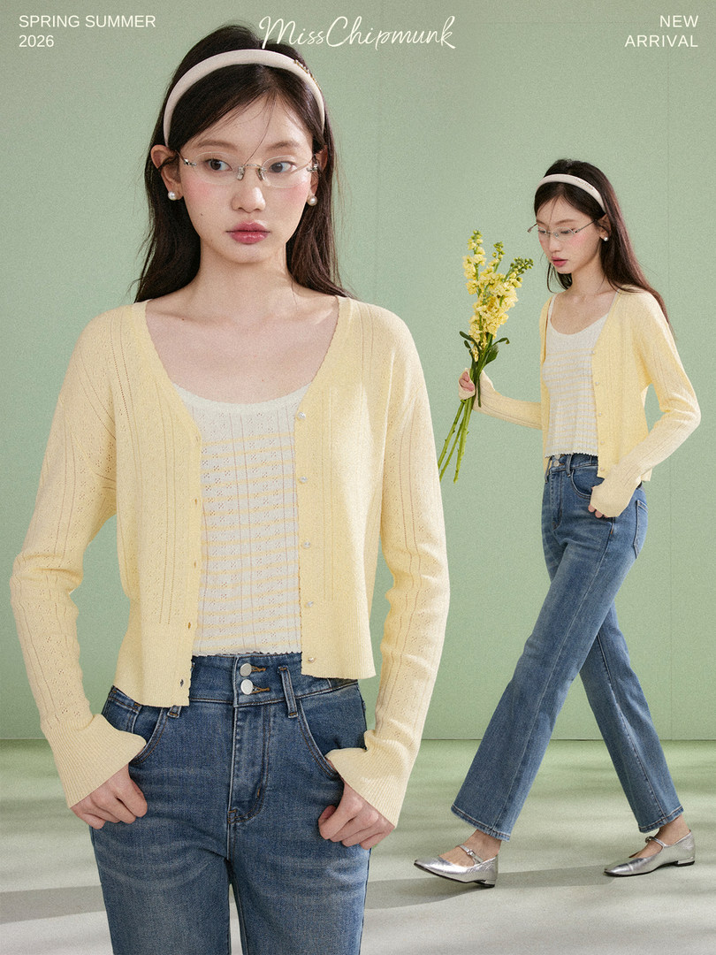 Model wearing a light yellow cardigan over a striped top with jeans in a spring/summer fashion promo