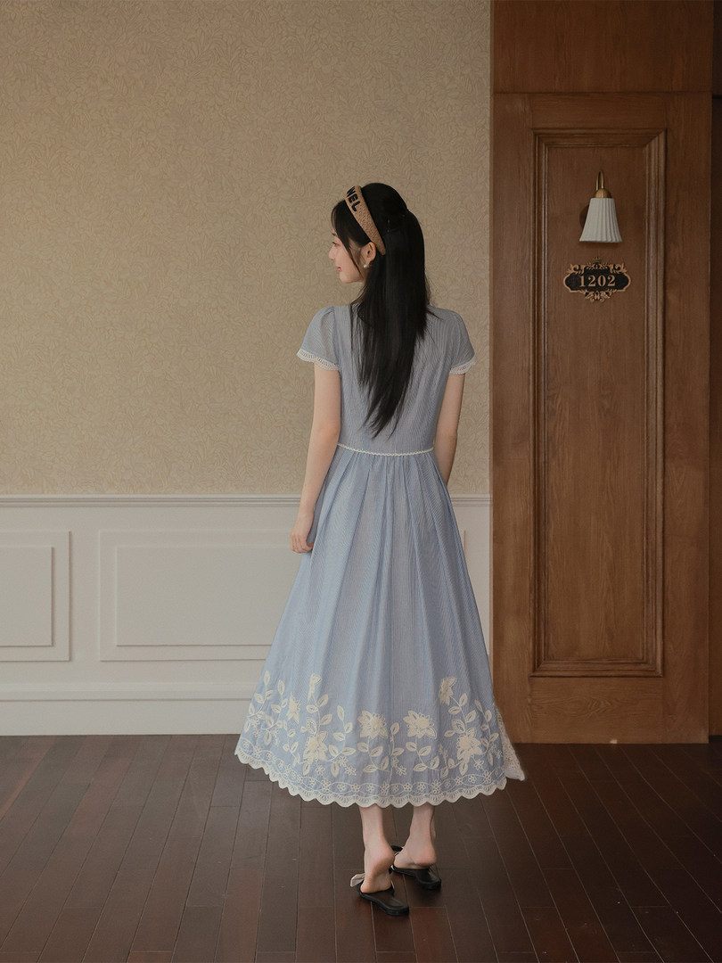 Woman wearing a light blue floral long dress