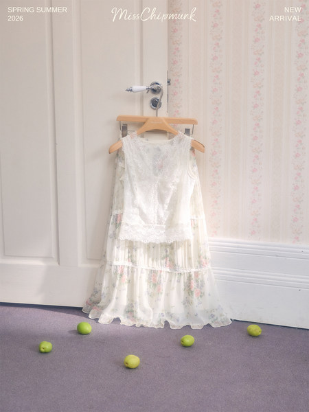 White floral lace dress displayed on a hanger