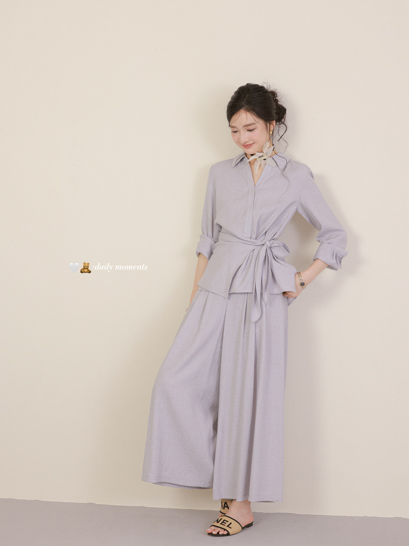 Woman wearing a light lavender matching blouse and wide-leg pants set