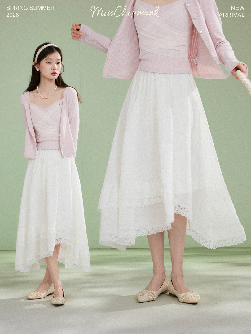 Pastel pink cardigan and white asymmetrical midi skirt worn by a model with promotional text overlay