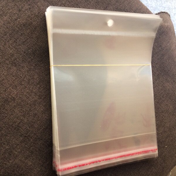 现货批发7丝10*15透明袋子自粘袋饰品头饰发饰等包装袋卡头挂孔