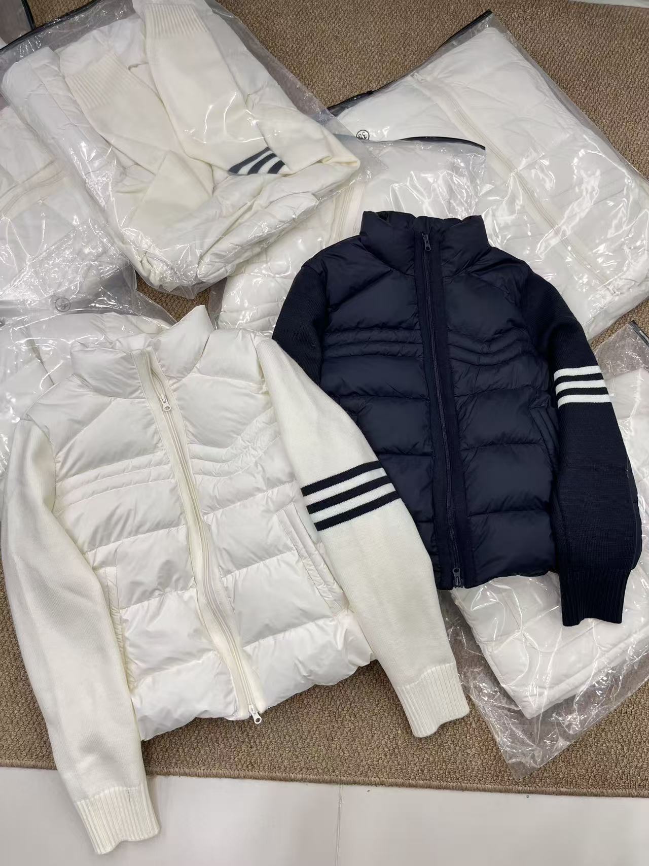 欧洲站2025秋冬新款欧货时尚立领拉链拼接针织袖羽绒服外套女