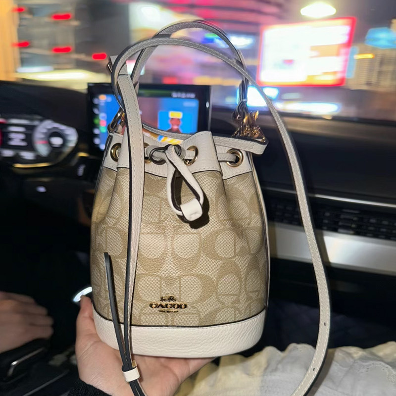 蔻家正品真皮斜挎水桶包