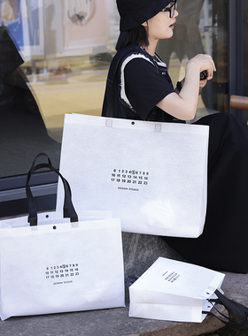 极简风白色无纺布手提袋定制LOGO环保礼品购物袋服装店手提包装袋