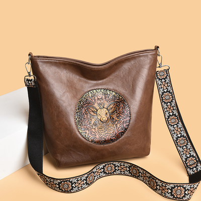 真皮质感大容量水桶包包女2025新款民族风浮雕彩绘妈妈单肩斜挎包