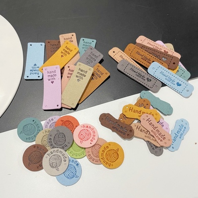 超纤皮标 handmade圆形方形带孔压花帽子手工包童装服装辅料标签