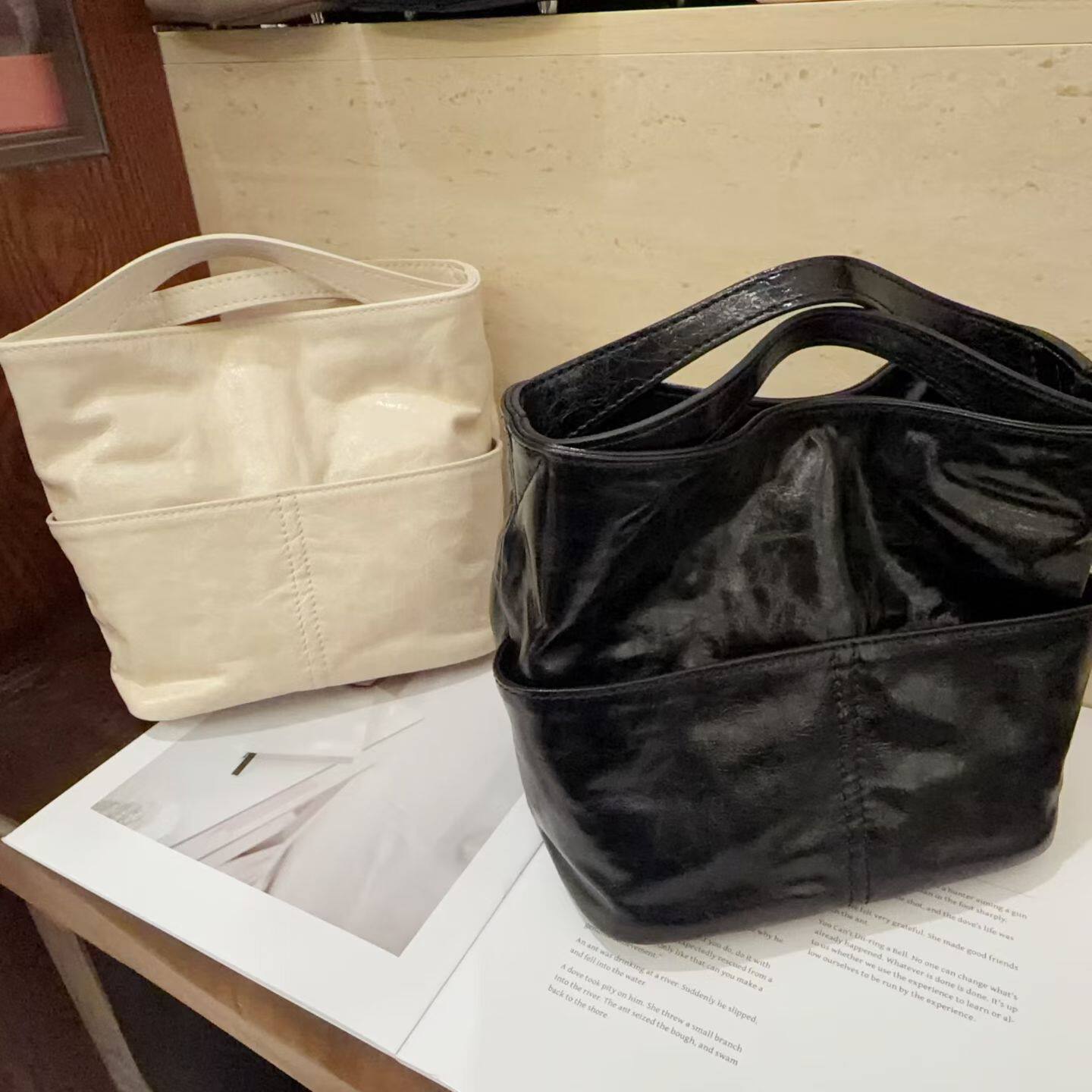 欧洲站2026新款植揉牛皮水桶包真皮复古单肩手拎包上班通勤斜挎包