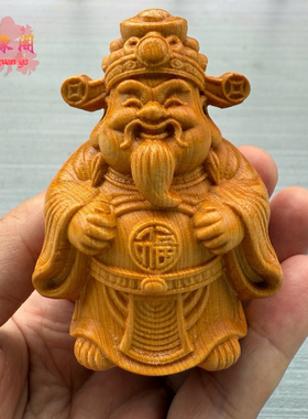 崖柏木雕麒麟龙头马上有钱摆件
