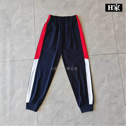 订做秭归县三峡工程希望小学深蓝色校服运动裤子侧边拼红白条束口