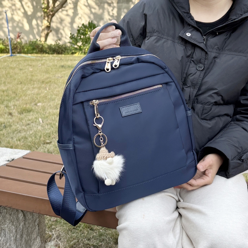 牛津布双肩包女通勤轻便帆布包新款时尚休闲旅行背包电脑包大学生