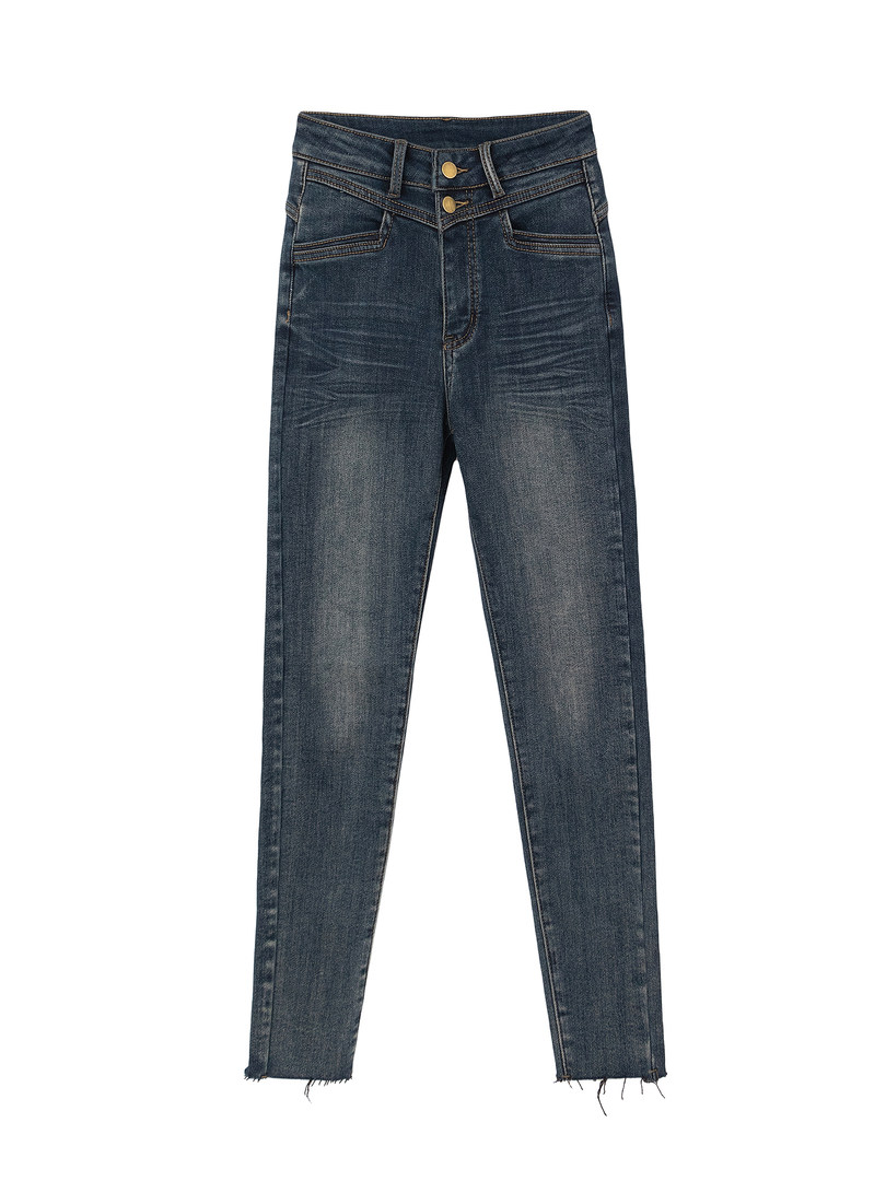 Dark blue denim jeans with frayed hems displayed flat