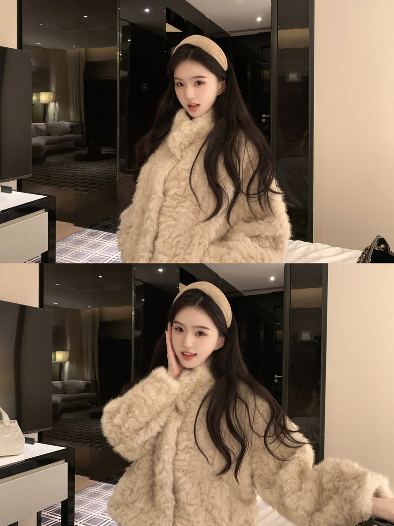 Woman wearing a beige fluffy coat and headband in a hotel room setting