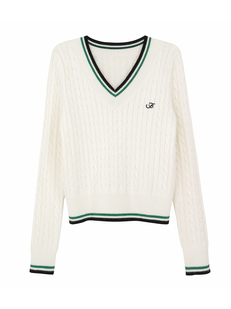 White cable knit sweater with green and black trim