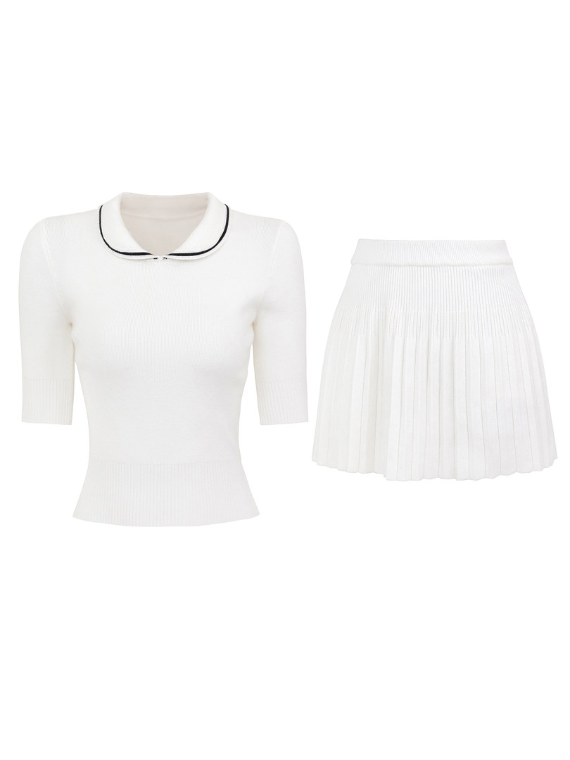White knit top with black trim collar and matching pleated skirt