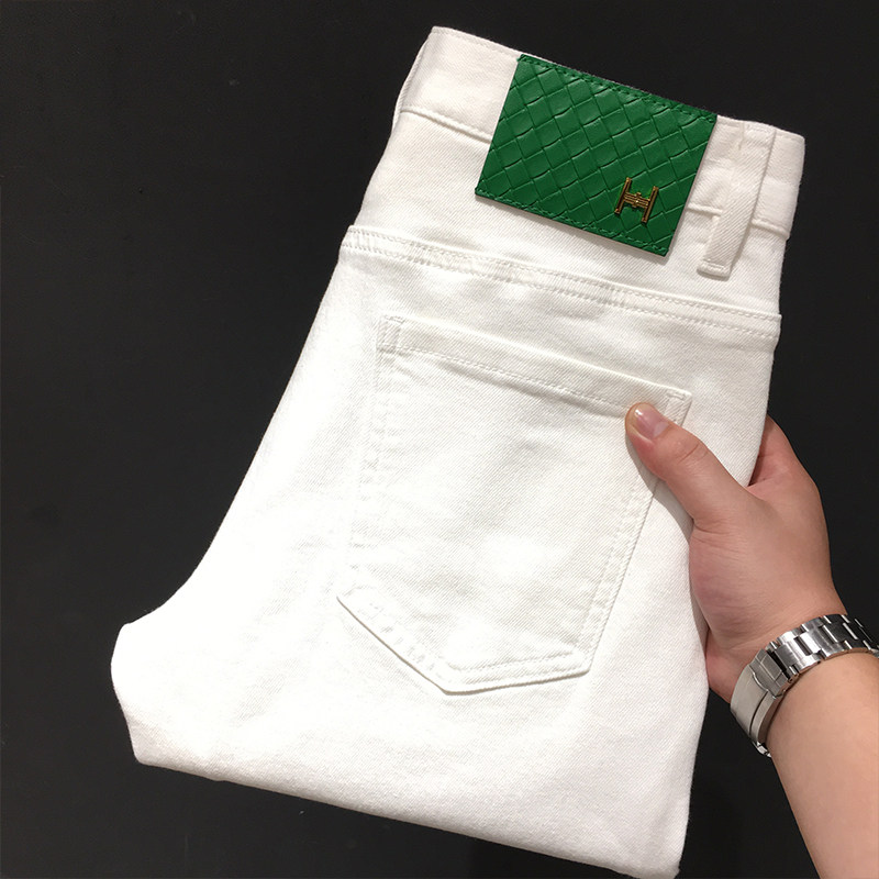 高端白色牛仔长裤男夏季薄款潮流欧货弹力修身小脚九分裤白色裤子