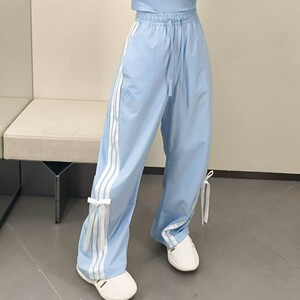 阿迪达斯女子蝴蝶结条纹梭织长裤