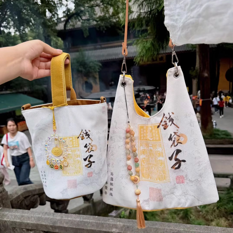 钱袋子水桶包帆布女生单肩手提包休闲旅行庙同款布袋包