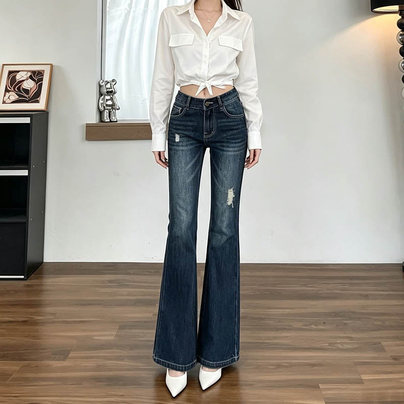 深蓝色破洞微喇牛仔裤女2026秋季新款辣妹弹力紧身显瘦喇叭长裤子