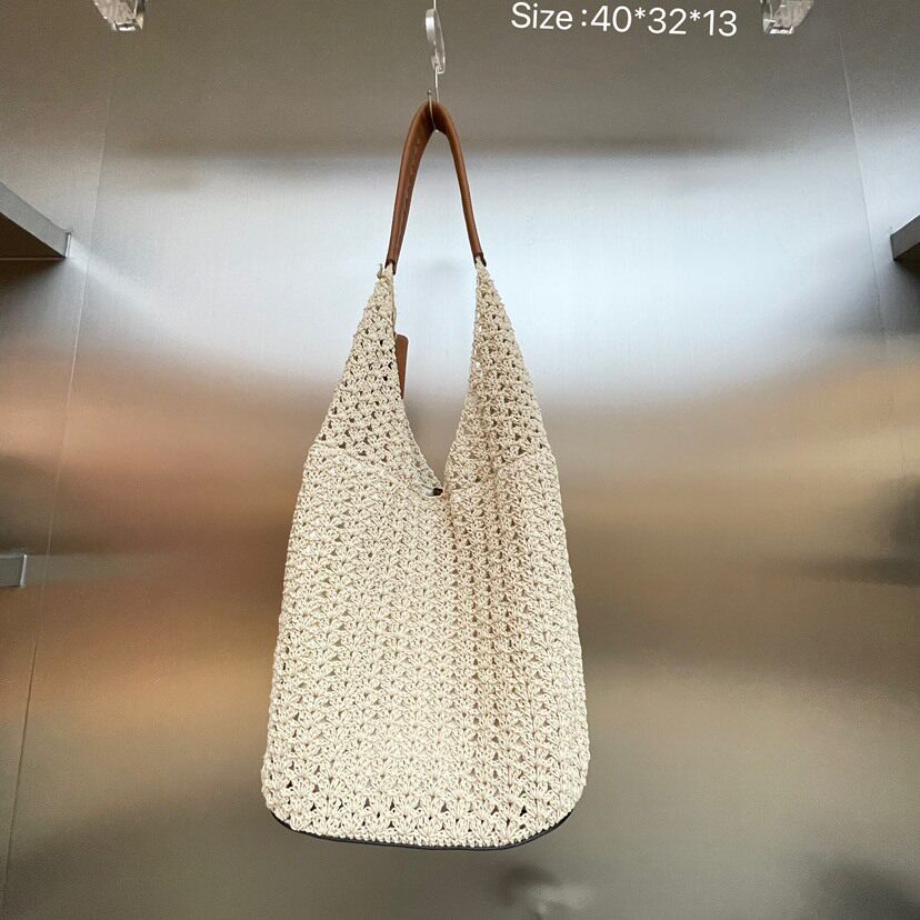 包包女2025新品网红撞色牛皮大容量托特包编织镂空手提单肩腋下包