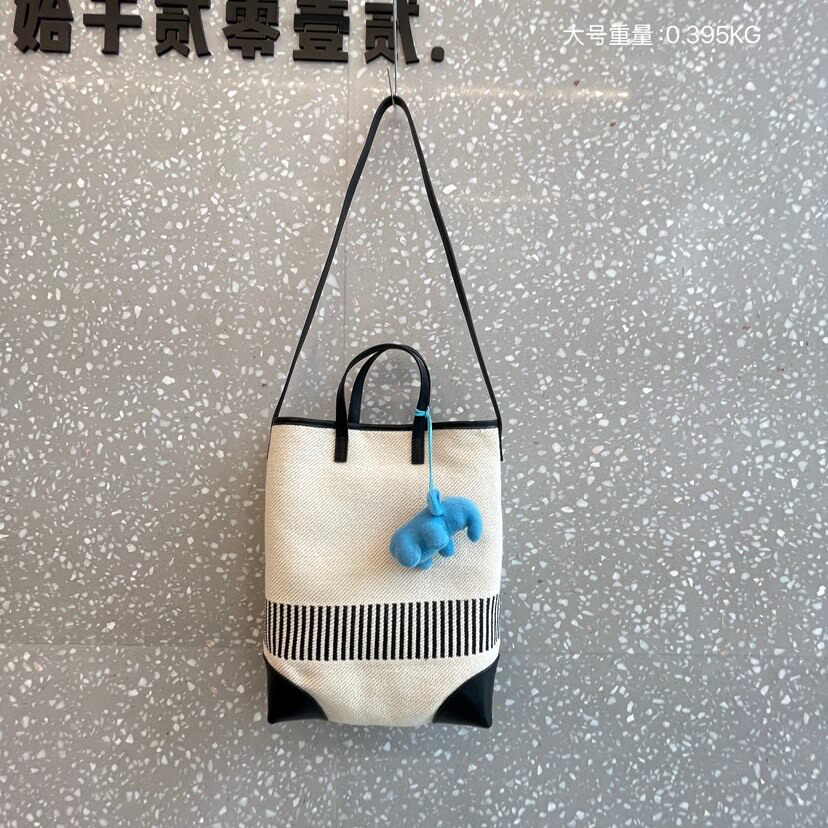 大容量条纹托特包包女2025新款撞色牛皮休闲帆布单肩斜挎水桶包潮