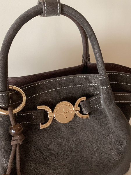 Dark brown leather handbag with gold-tone hardware and top handles