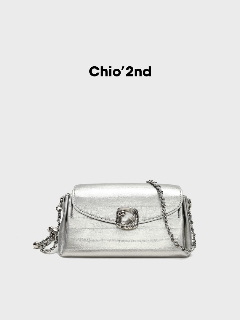 Silver metallic chain-strap shoulder bag on a plain background