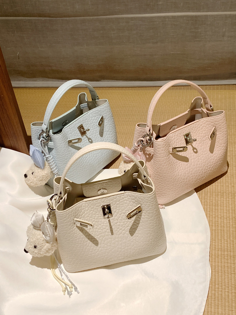 Pastel textured bucket handbags with teddy bear charms