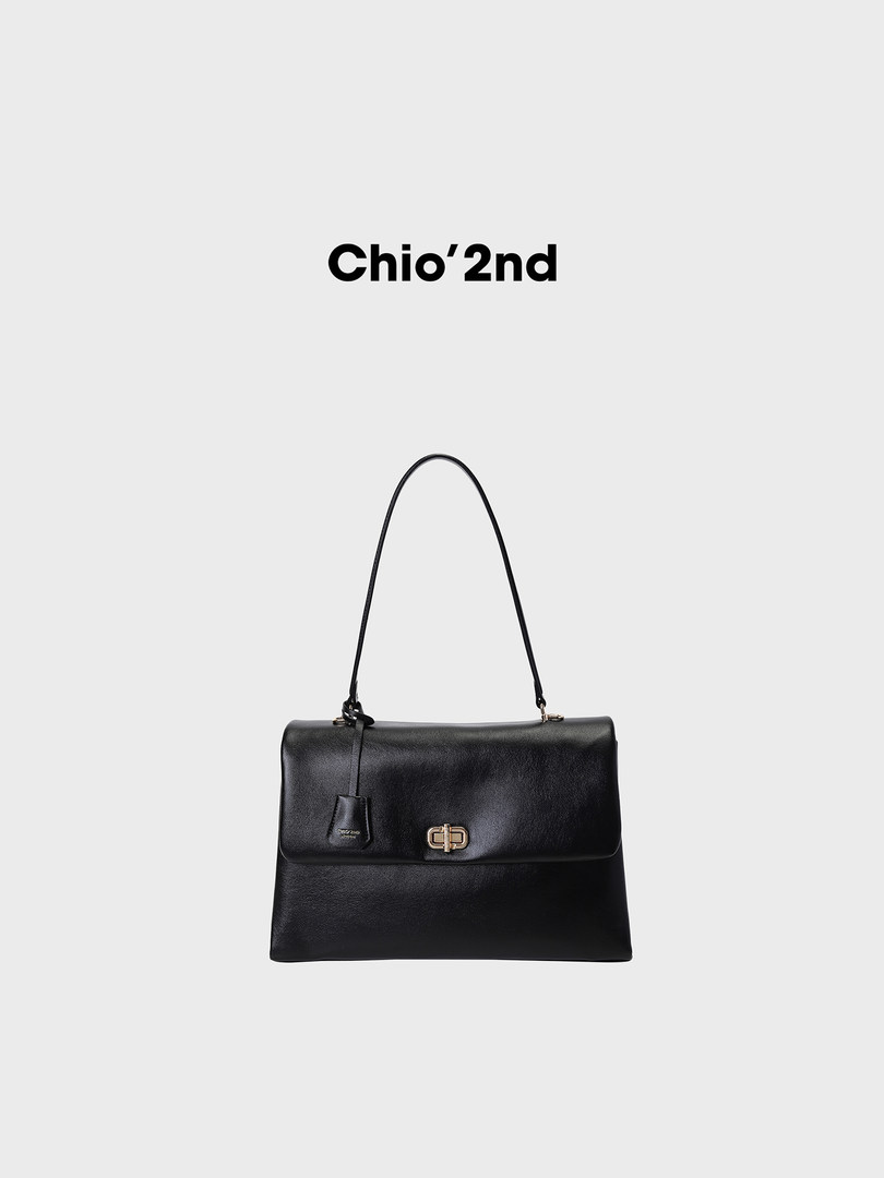 Black leather handbag with long shoulder strap and gold clasp