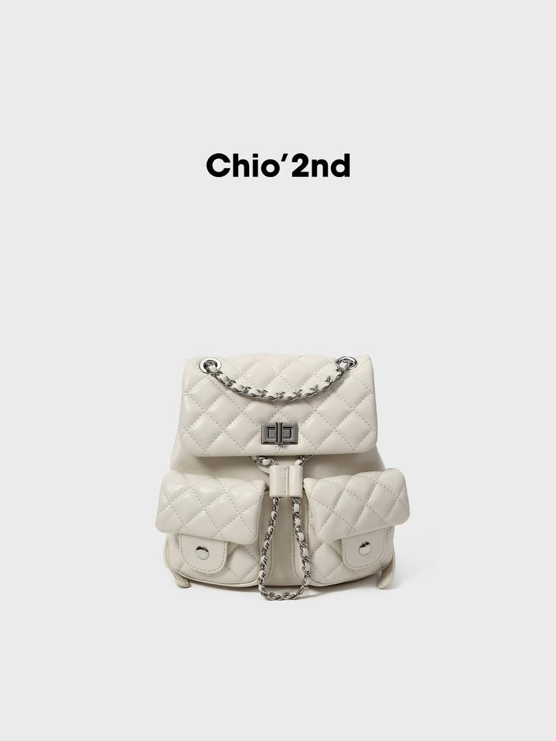 White quilted chain backpack with front pockets on a plain background
