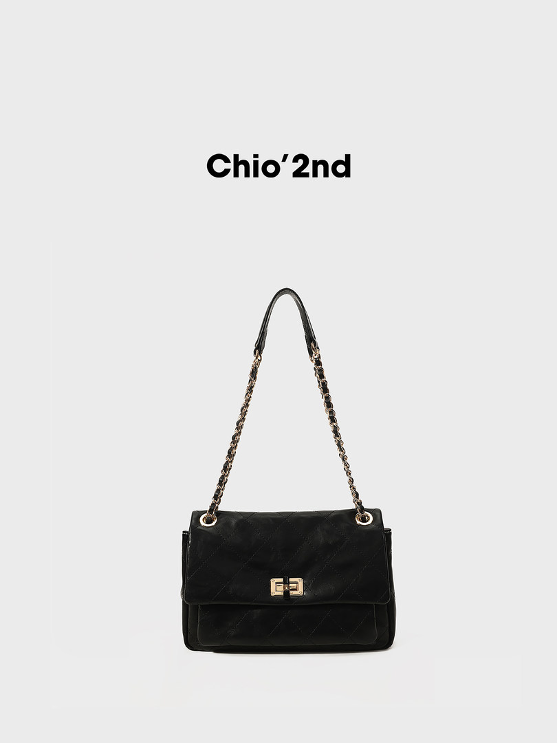 Black quilted chain-strap shoulder bag on a white background