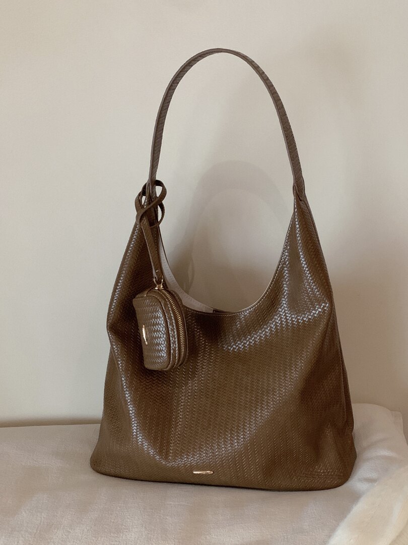 Brown woven hobo shoulder bag with a matching mini pouch